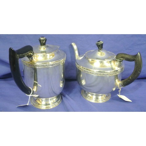 26 - Silver plated teapot and hot water pot with Celtic banding and shaped handles