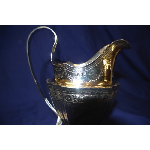 293 - Irish Silver George III bright cut panelled cream jug with shaped rim and handle, foliate engraving,... 