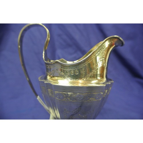 293 - Irish Silver George III bright cut panelled cream jug with shaped rim and handle, foliate engraving,... 