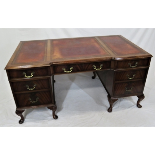 105 - Edwardian mahogany pedestal desk with seven drawers, leatherette inset, brass drop handles, on cabri... 