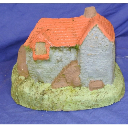 154 - Carved stone model of a mill house on shaped base