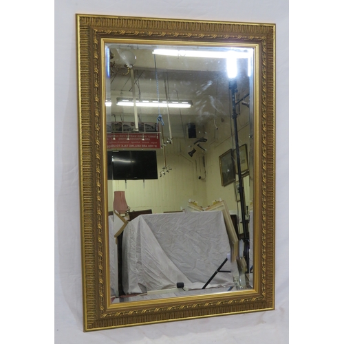 144 - Regency design gilt framed bevelled glass wall mirror with foliate decoration