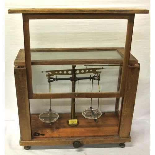 142 - Gallenkamp brass & metal weighing scales, glazed case, with adjustable legs