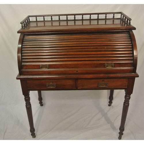 145 - Victorian mahogany desk with railed top, tambour pull-down front, fitted interior, pull-out writing ... 