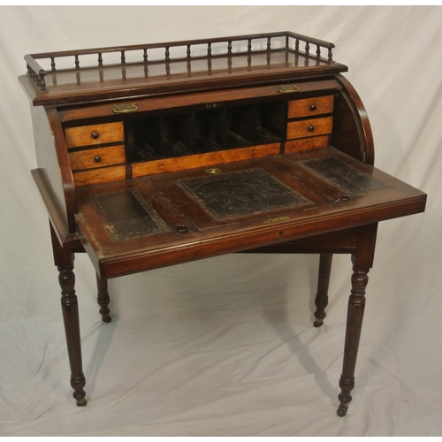 145 - Victorian mahogany desk with railed top, tambour pull-down front, fitted interior, pull-out writing ... 