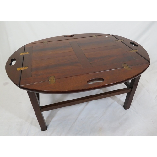 146 - Edwardian mahogany butlers tray with folding demi-lune pierced handles on stand with stretchers