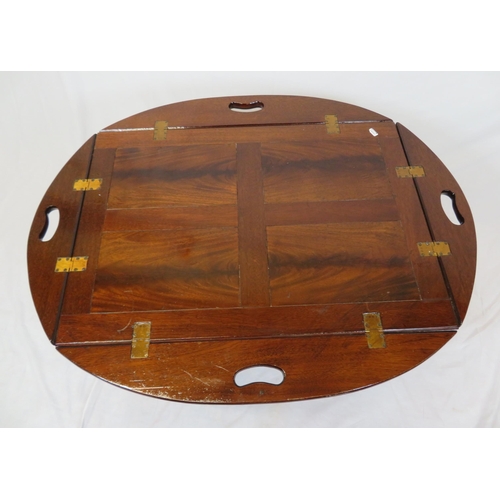 146 - Edwardian mahogany butlers tray with folding demi-lune pierced handles on stand with stretchers