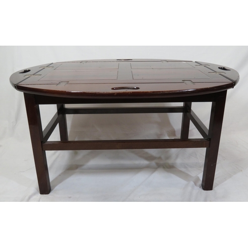 146 - Edwardian mahogany butlers tray with folding demi-lune pierced handles on stand with stretchers