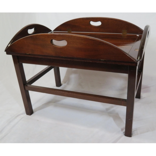 146 - Edwardian mahogany butlers tray with folding demi-lune pierced handles on stand with stretchers