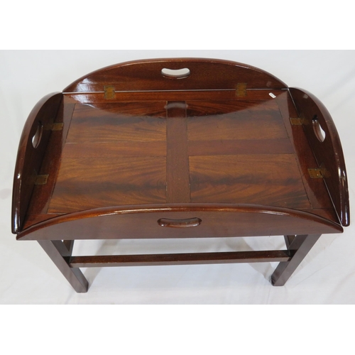 146 - Edwardian mahogany butlers tray with folding demi-lune pierced handles on stand with stretchers