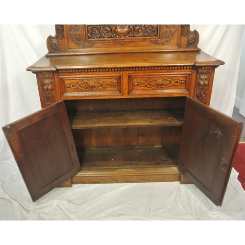 20 - Victorian style walnut chiffonier with shaped back, mirror inset, shelved press under with panelled ... 