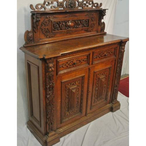 20 - Victorian style walnut chiffonier with shaped back, mirror inset, shelved press under with panelled ... 