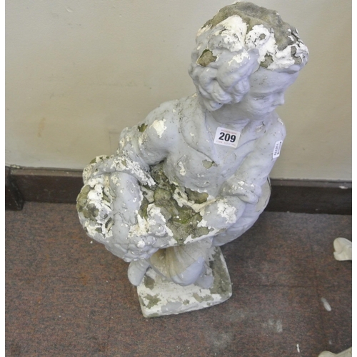 209 - Stone ornament of a boy with basket, on square base