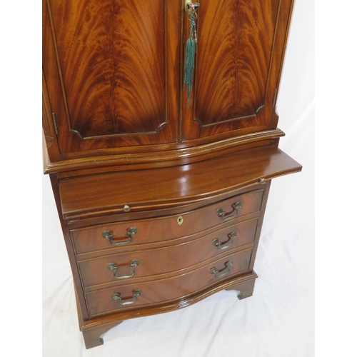 210 - Edwardian mahogany serpentine fronted bachelors cabinet with shelved interior, pull-out shelf, four ... 