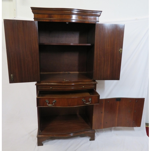 210 - Edwardian mahogany serpentine fronted bachelors cabinet with shelved interior, pull-out shelf, four ... 