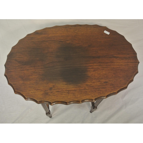 24 - Oval oak Victorian occasional table with wavy border, turned columns & legs