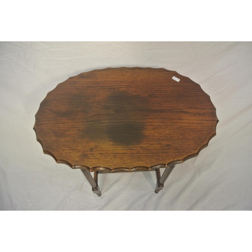 24 - Oval oak Victorian occasional table with wavy border, turned columns & legs