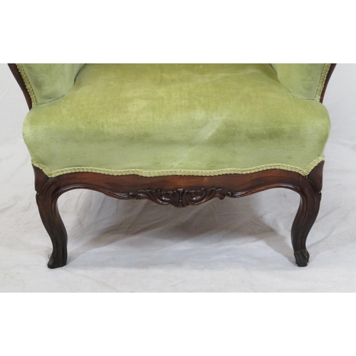 306 - Victorian mahogany open armchair with foliate carved back, buttoned upholstery, on cabriole legs