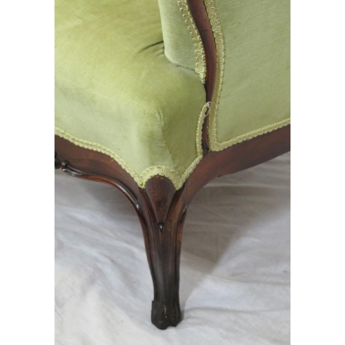 306 - Victorian mahogany open armchair with foliate carved back, buttoned upholstery, on cabriole legs