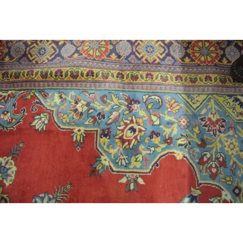 37 - Fine woven Persian Sarouk Viss carpet terracotta ground with hints of duck egg blue medallion design... 