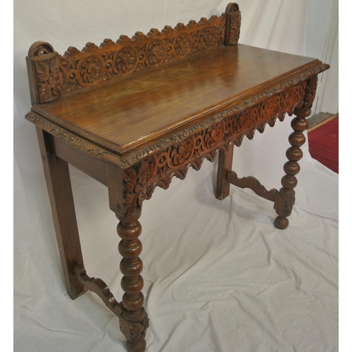 39 - Victorian oak side table with ornate foliate carving, on ball turned legs with stretchers