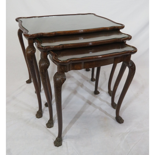 46 - Victorian nest of three mahogany glass topped tables with serpentine borders, on carved cabriole leg... 