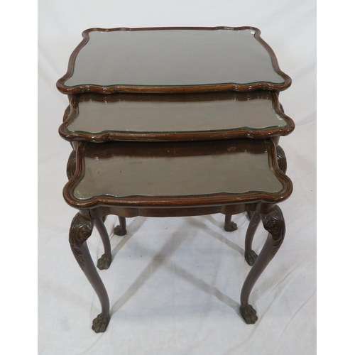 46 - Victorian nest of three mahogany glass topped tables with serpentine borders, on carved cabriole leg... 