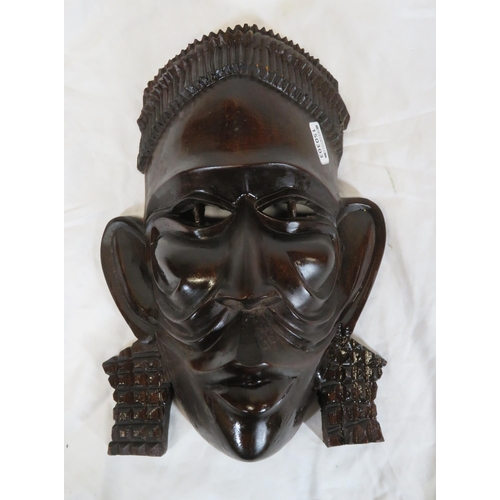 57 - Pair of African tribal art carved face masks