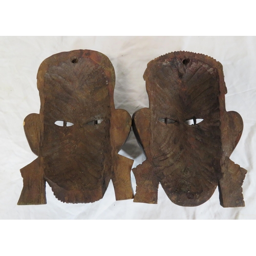 57 - Pair of African tribal art carved face masks