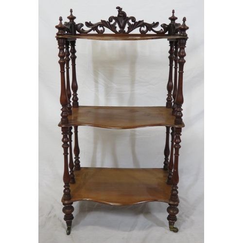 71 - Victorian walnut three tier whatnot with serpentine shaped fronts, pierced gallery, shaped finials, ... 