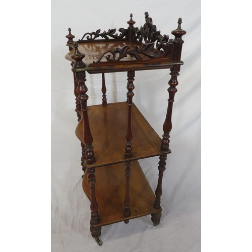 71 - Victorian walnut three tier whatnot with serpentine shaped fronts, pierced gallery, shaped finials, ... 