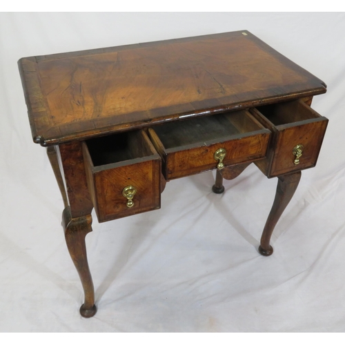 80 - Queen Anne crossbanded walnut lowboy with three drawers, brass tear drop handles, shaped apron, on c... 