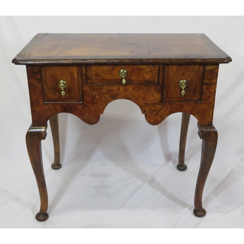 80 - Queen Anne crossbanded walnut lowboy with three drawers, brass tear drop handles, shaped apron, on c... 