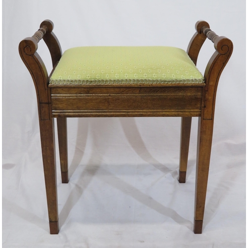 94 - Edwardian mahogany piano stool with upholstered lift-up lid, turned handles & tapering legs