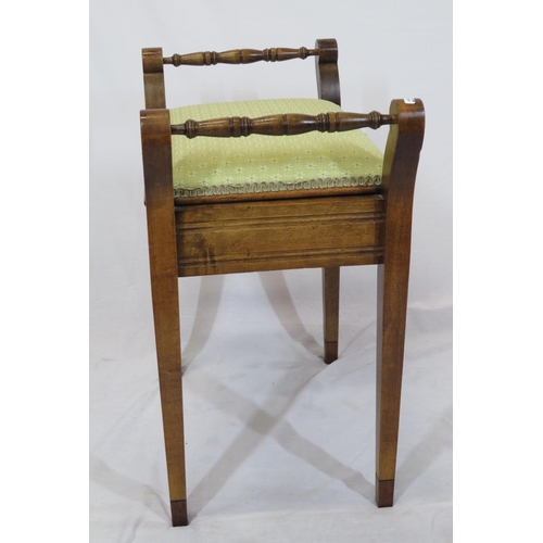 94 - Edwardian mahogany piano stool with upholstered lift-up lid, turned handles & tapering legs