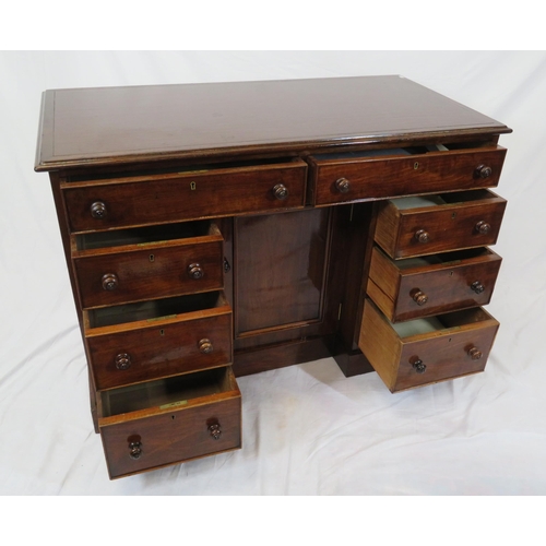 95 - Edwardian mahogany desk with two frieze drawers, three side drawers, central press, on shaped plinth