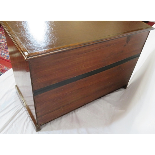 95 - Edwardian mahogany desk with two frieze drawers, three side drawers, central press, on shaped plinth