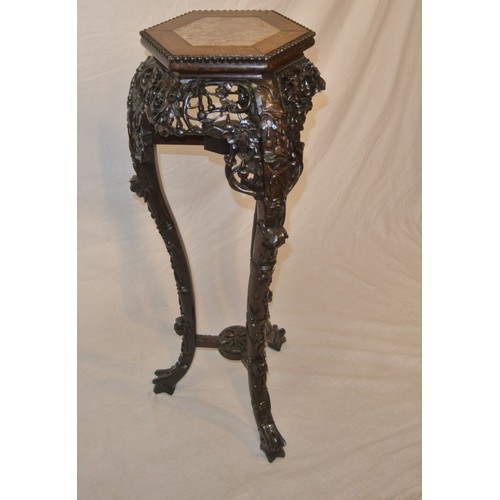 217 - Oriental hexagonal carved teak jardiniere or bust stand with marble inset, ornate foliate & scroll c... 