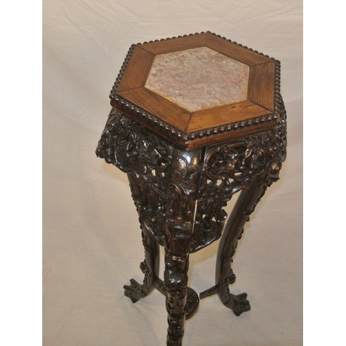 217 - Oriental hexagonal carved teak jardiniere or bust stand with marble inset, ornate foliate & scroll c... 