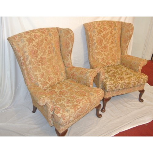 320 - Pair of Victorian style wingback armchairs with foliate upholstery, on cabriole legs with pad feet