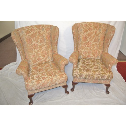 320 - Pair of Victorian style wingback armchairs with foliate upholstery, on cabriole legs with pad feet