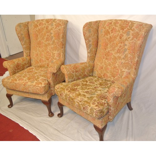 320 - Pair of Victorian style wingback armchairs with foliate upholstery, on cabriole legs with pad feet