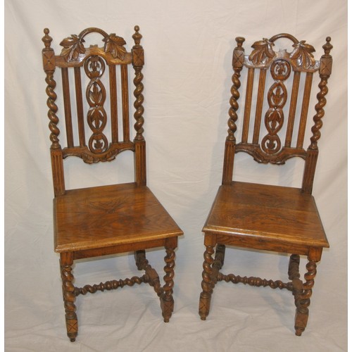 307 - Pair of Victorian carved oak high back hall chairs with foliate carved & twisted rails, on barleytwi... 