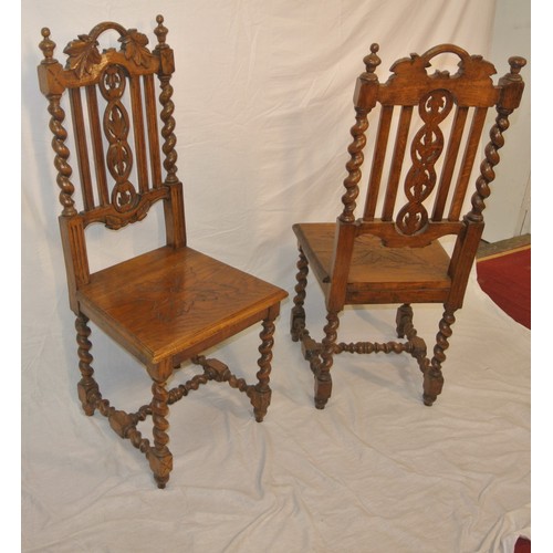 307 - Pair of Victorian carved oak high back hall chairs with foliate carved & twisted rails, on barleytwi... 