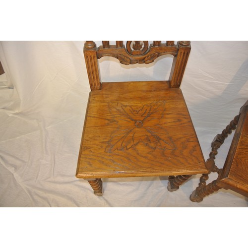 307 - Pair of Victorian carved oak high back hall chairs with foliate carved & twisted rails, on barleytwi... 