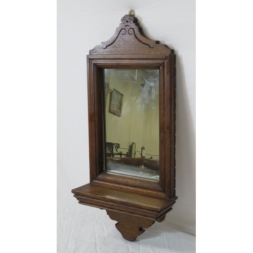 33 - Edwardian oak framed wall mirror with shaped top & base