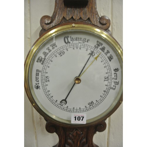 107 - Victorian oak wheel barometer with brass framed dial & thermometer