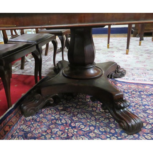 100 - Georgian mahogany square topped library or breakfast table with tip-up top, raised on hexagonal balu... 