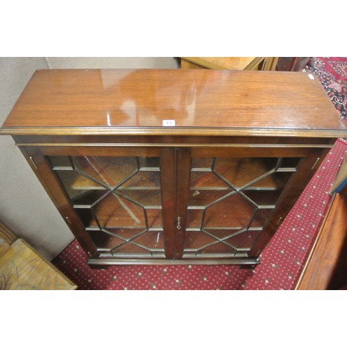 15 - Edwardian mahogany floor bookcase with astragal glazed doors, shelved interior, on bracket feet