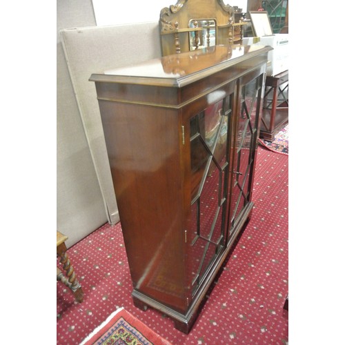 15 - Edwardian mahogany floor bookcase with astragal glazed doors, shelved interior, on bracket feet